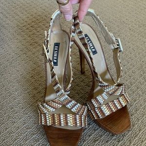 Amazing woven gold,brown and tan leather straps with wooden heels.